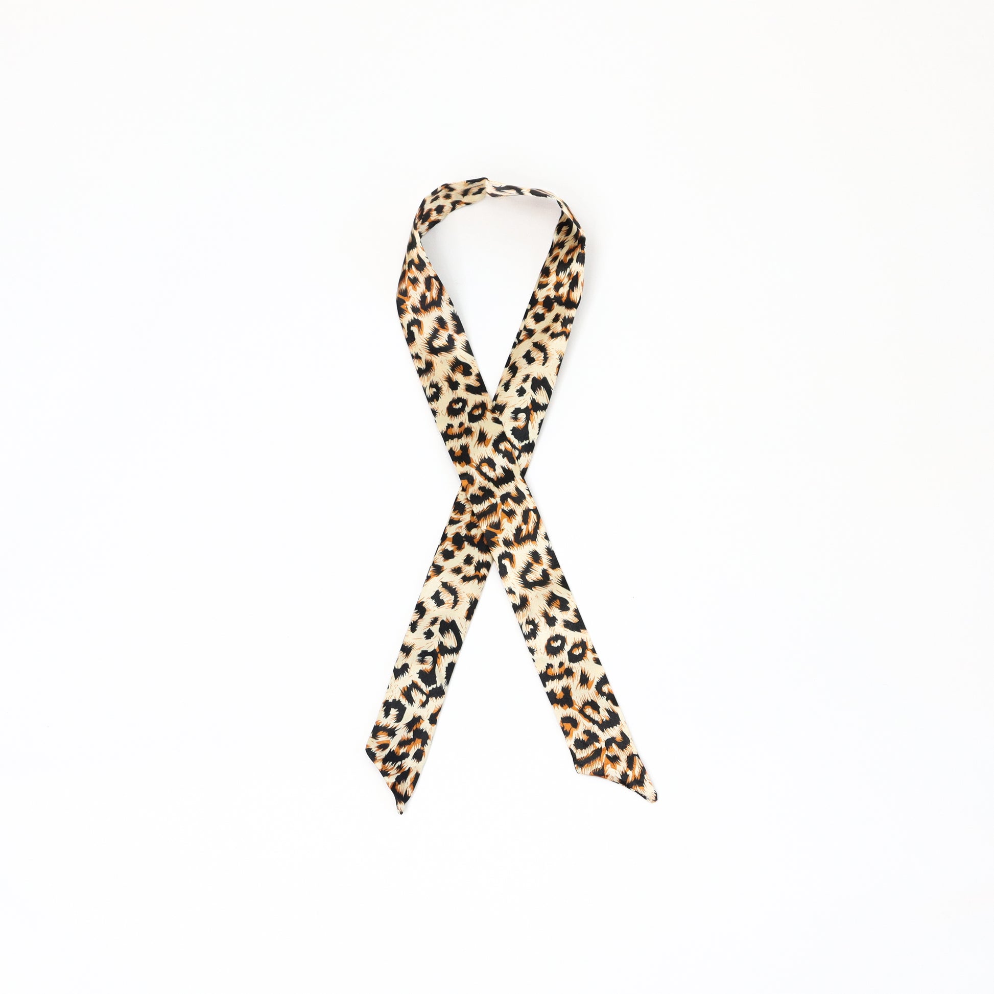 A twilly scarf with a softer, lighter cheetah print design