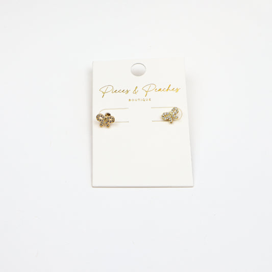 Dainty gold bow stud earrings with cubic zirconia accents