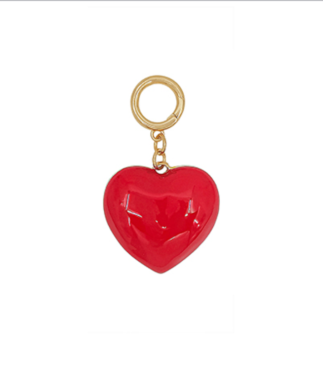 Red enamel heart charm with gold clasp on white background — stylish heart pendant accessory.