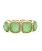A gold-colored metal bracelet with multifaceted olive gemstones set in a stretch design.