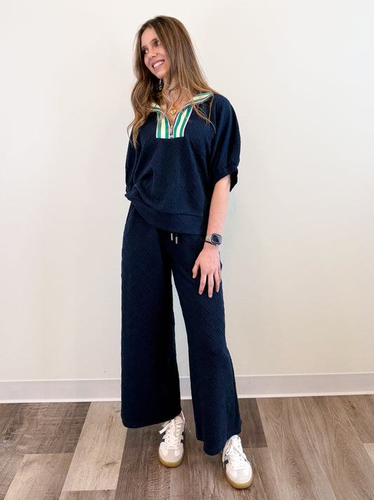 Midtown Lounge Pants in navy, featuring a relaxed wide-leg fit, textured knit fabric, and an adjustable drawstring waist for the perfect blend of comfort and style
