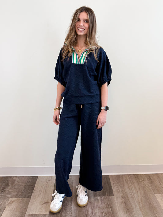 Midtown Lounge Pants in navy, featuring a relaxed wide-leg fit, textured knit fabric, and an adjustable drawstring waist for the perfect blend of comfort and style