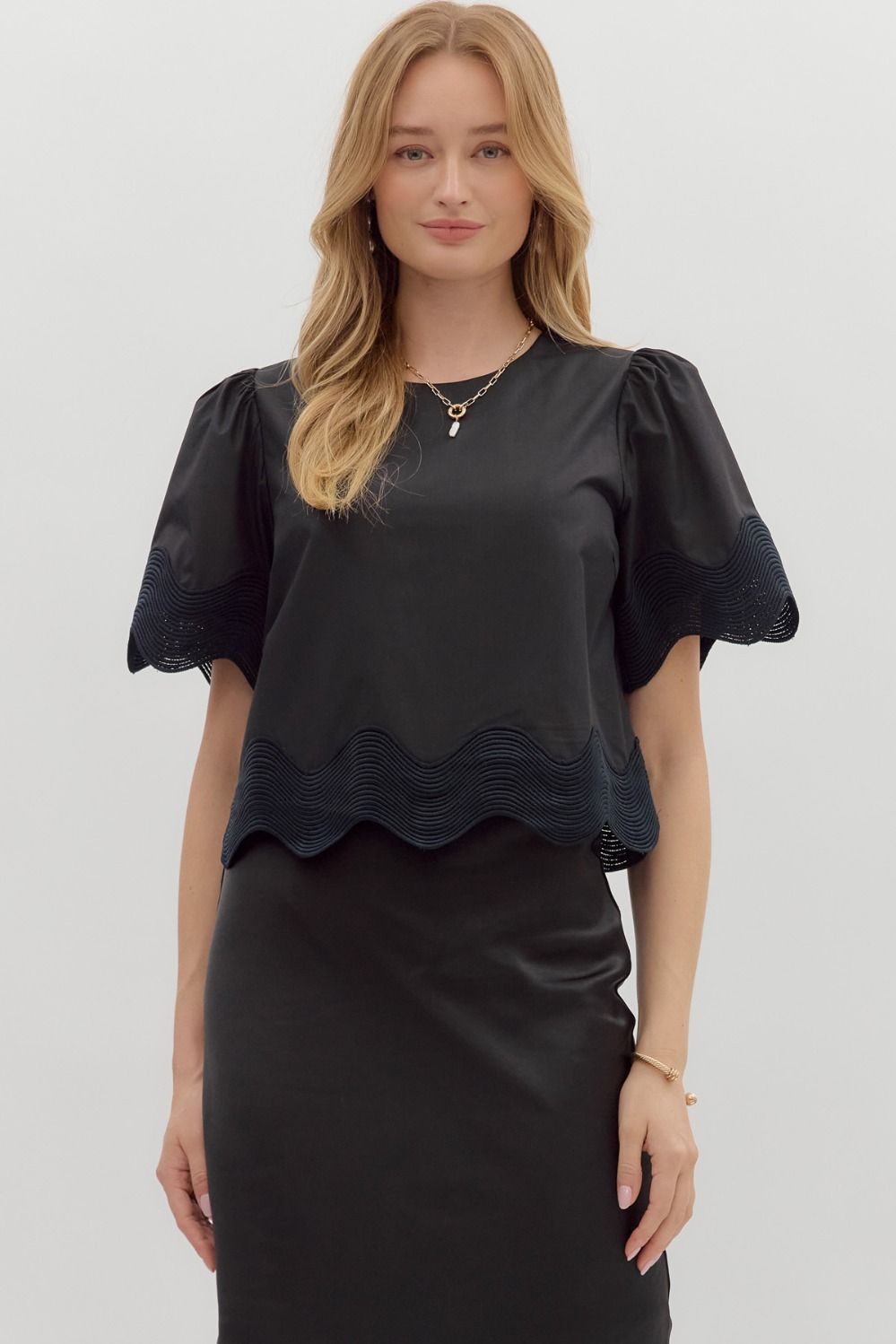Minimalist short sleeve blouse with oversized trim details—perfect for effortless summer layering.

