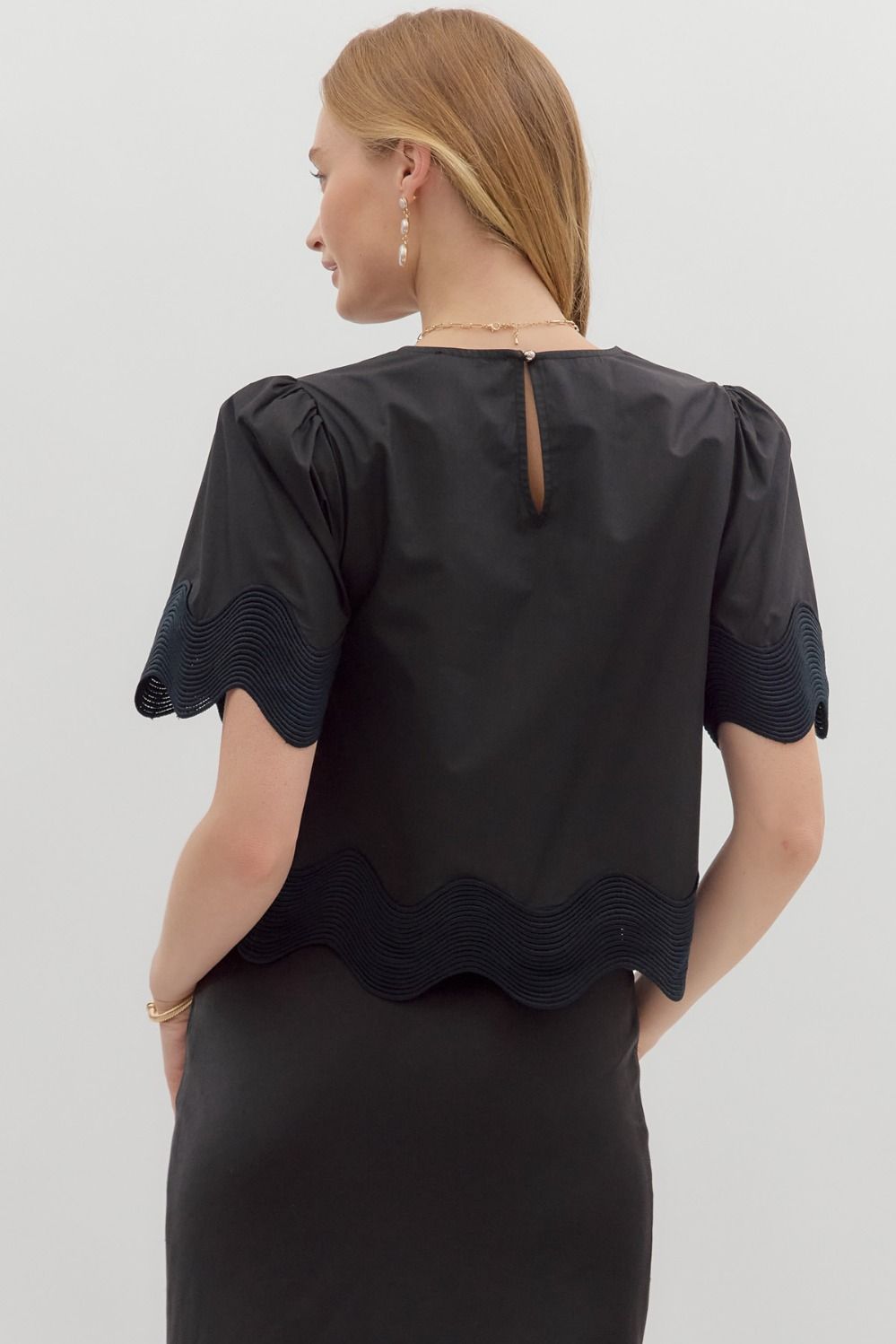 Minimalist short sleeve blouse with oversized trim details—perfect for effortless summer layering.
