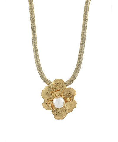 Gold-tone snake chain necklace with a textured floral pendant and faux pearl center, displayed against a white background.
