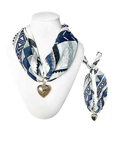 Heart Pendant Scarf Necklace  featuring patterned fabric bandana worn as a necklace or bracelet, adorned with a gold heart charm, styled on a mannequin and laid flat for display.