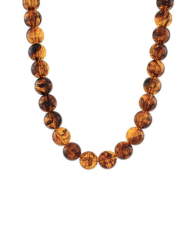 The Thalassa Tortoise Agate Bead Necklace blends earthy elegance with a warm tortoise hue.