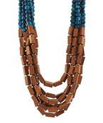 The Thalassa Brown Teal Beaded Necklace pairs earthy tones with vibrant teal for a refined boho-chic finish.