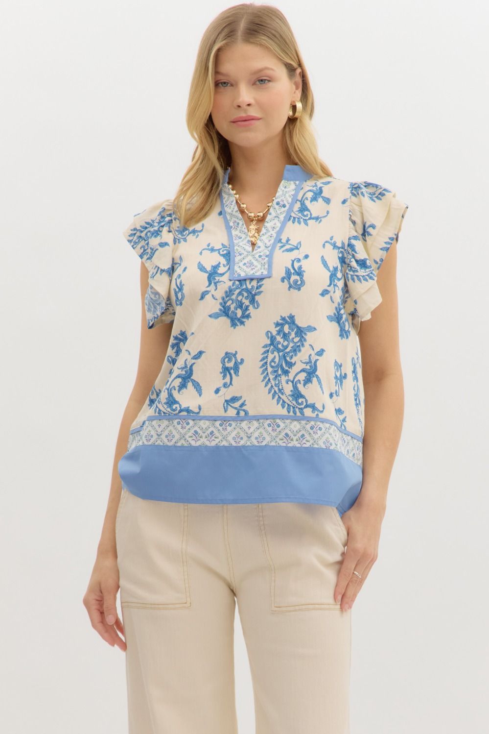 Paisley print tiered flutter sleeve pullover with multi-contrast band and hem details.


