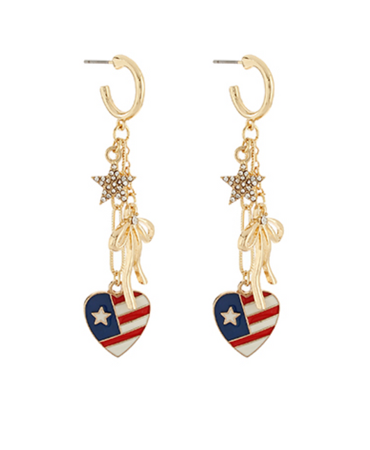 Pair of gold-tone drop earrings featuring a sparkling star, a delicate bow, and a heart-shaped charm with the American flag design.