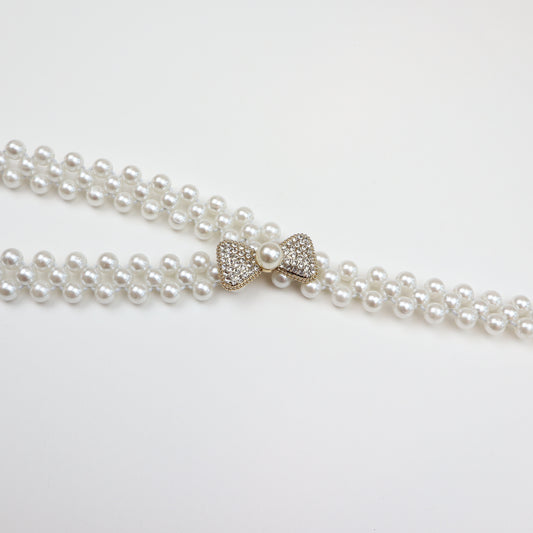 Elegant pearl stretch belt with jeweled accent and classic pearl detailing—perfect for formal occasions, bridal wear, or adding a touch of glamour to everyday outfits.
