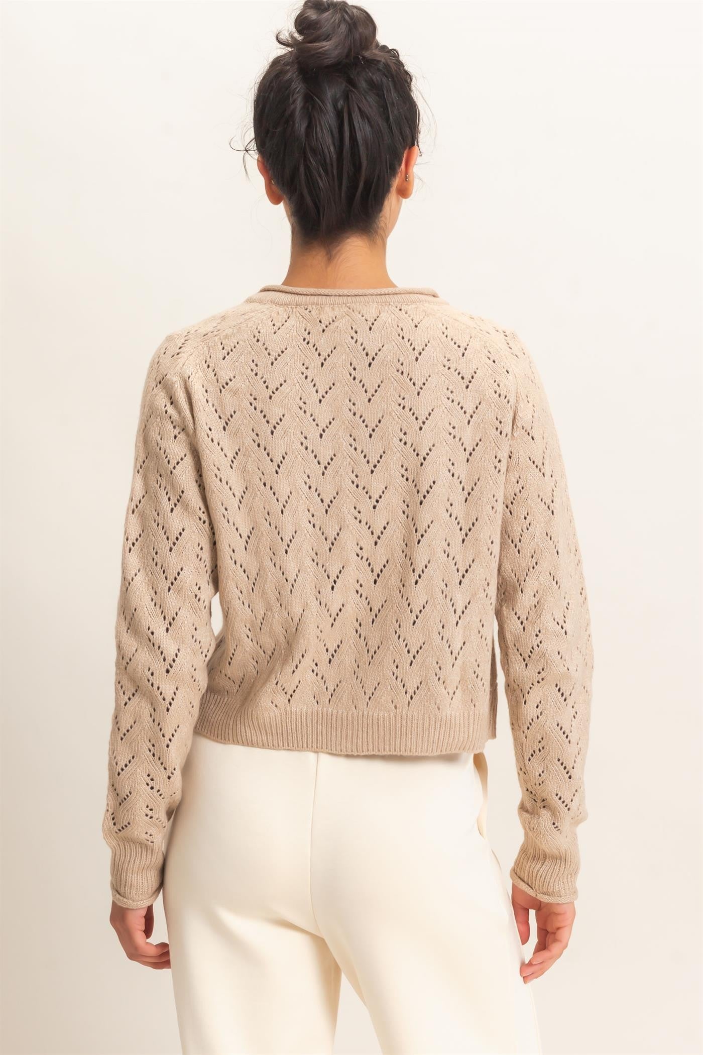 A timeless layering essential, this pointelle knit cardigan features a slightly cropped silhouette, button-front styling, and delicate details for effortless everyday charm.