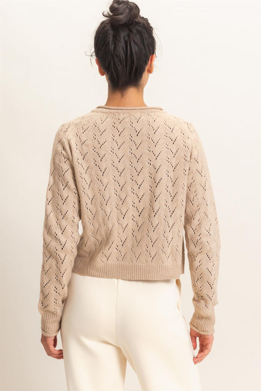 A timeless layering essential, this pointelle knit cardigan features a slightly cropped silhouette, button-front styling, and delicate details for effortless everyday charm.