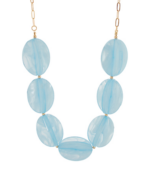  Short, chunky statement necklace featuring large, smooth, translucent light blue beads strung together.