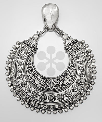 Ornate antique silver crescent tribal pendant with detailed engraving and dotted edge design.