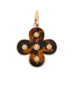 The Clarimond Tortoise Gold Charm blends classic gold shine with timeless tortoise pattern elegance.