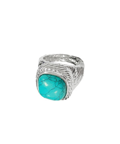 Cushion-cut turquoise gemstone ring with detailed silver-tone engraved setting, showcasing a bold boho-chic design.
