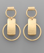 Gold geometric drop earrings featuring a modern mix of circles and rectangles on a neutral background.