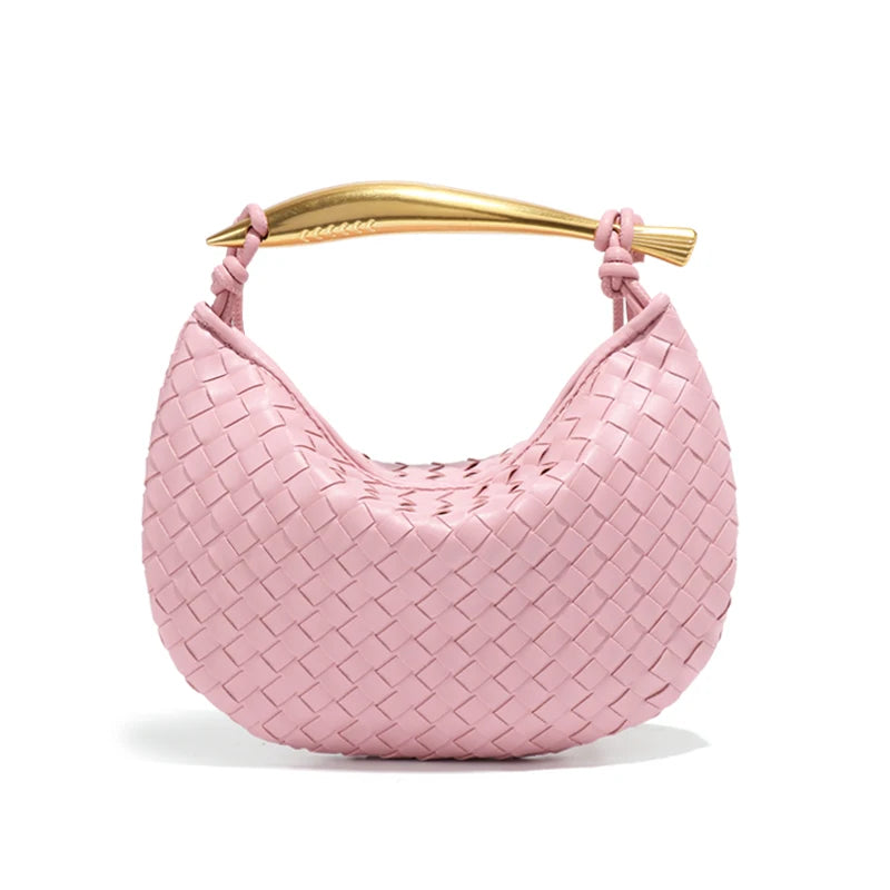 woven leather handbag with a bold gold sculptural handle for a modern, luxury look.