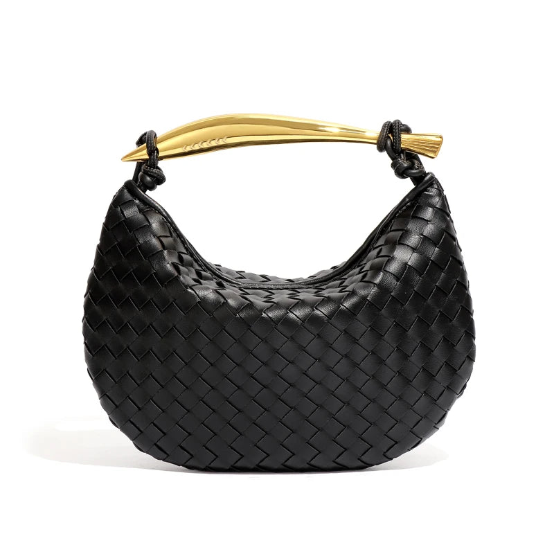 woven leather handbag with a bold gold sculptural handle for a modern, luxury look.