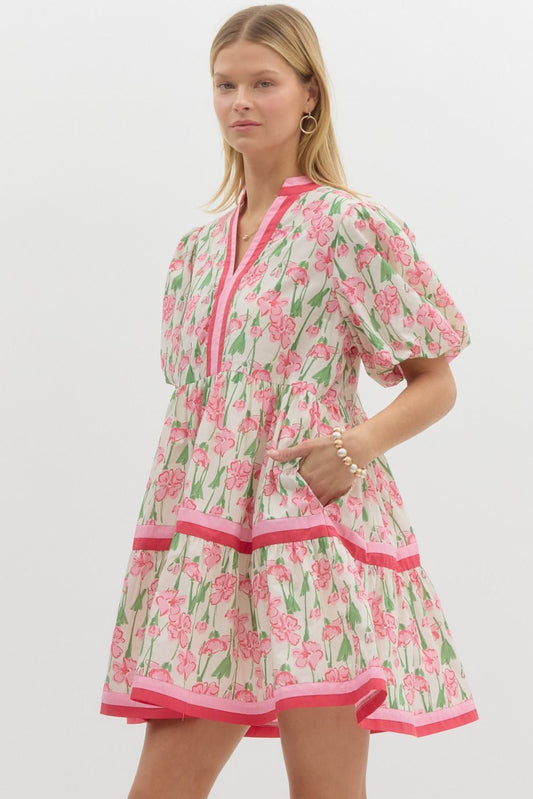 Close-up of Sarah Dress in pink floral with contrast trim, highlighting lightweight cotton fabric and pockets.