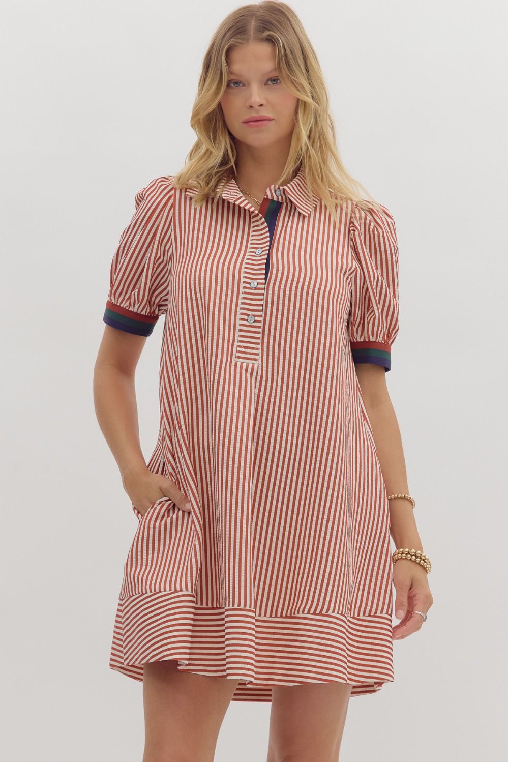 Short puff sleeve swing dress with multicolor ribbed accents and collar button closure.


