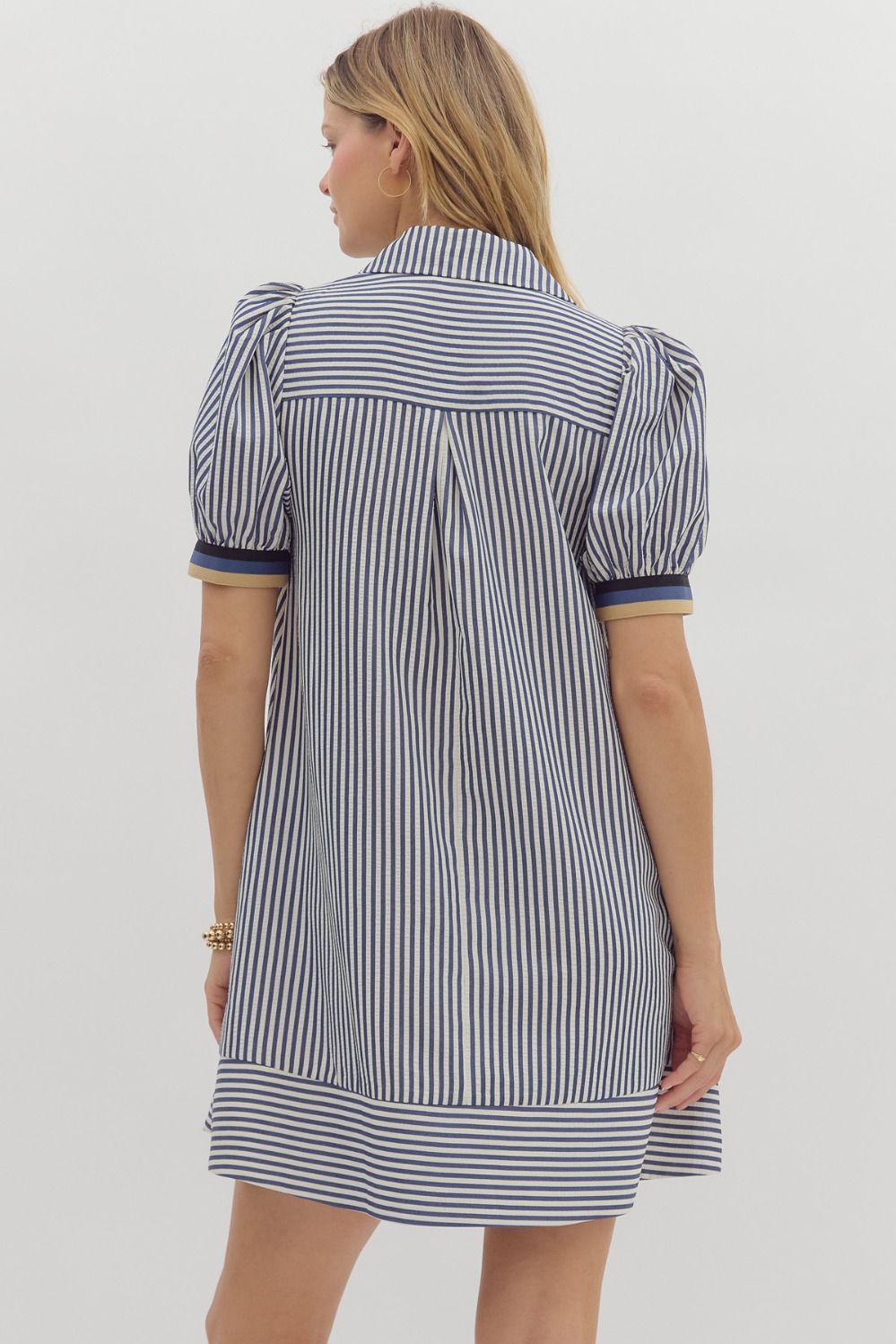 Short puff sleeve swing dress with multicolor ribbed accents and collar button closure.

