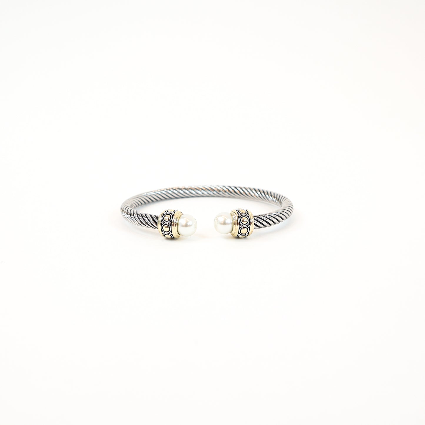 Elegant twisted cuff with intricate detailing