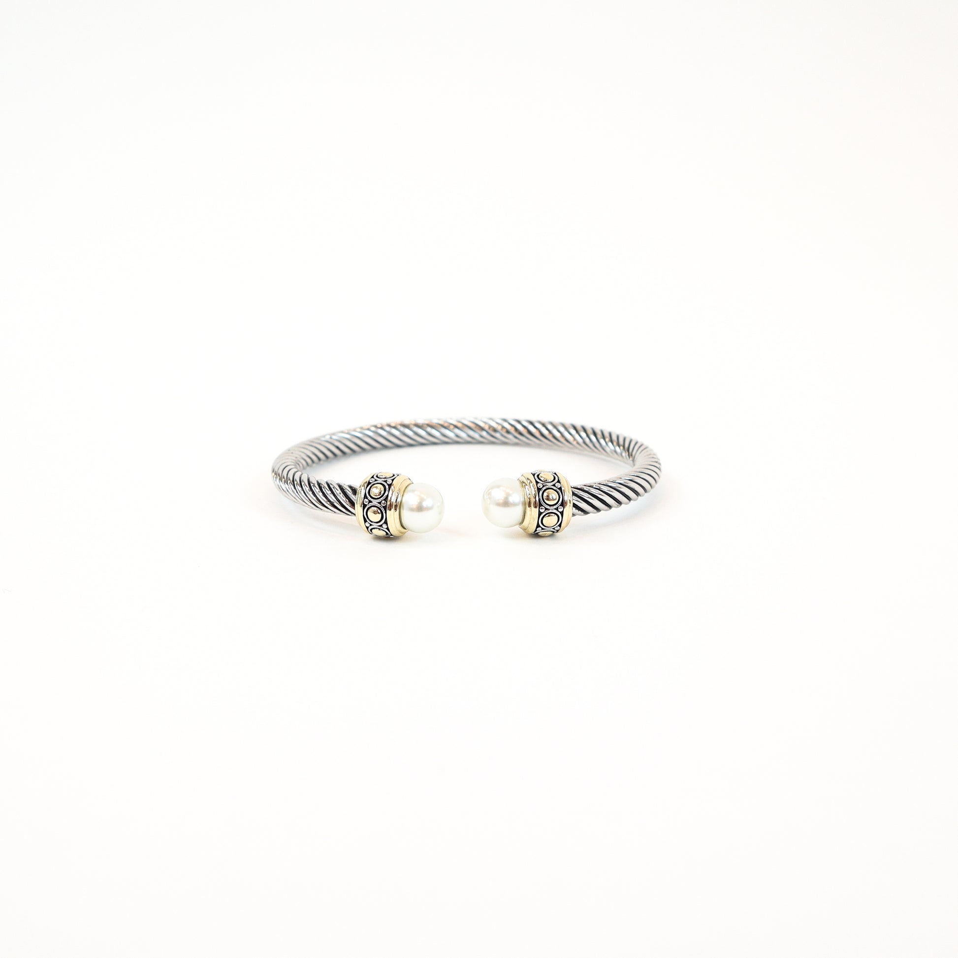 Elegant twisted cuff with intricate detailing