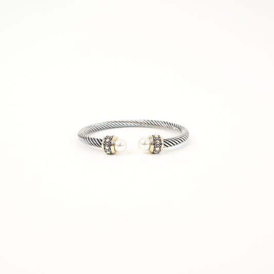 Elegant twisted cuff with intricate detailing