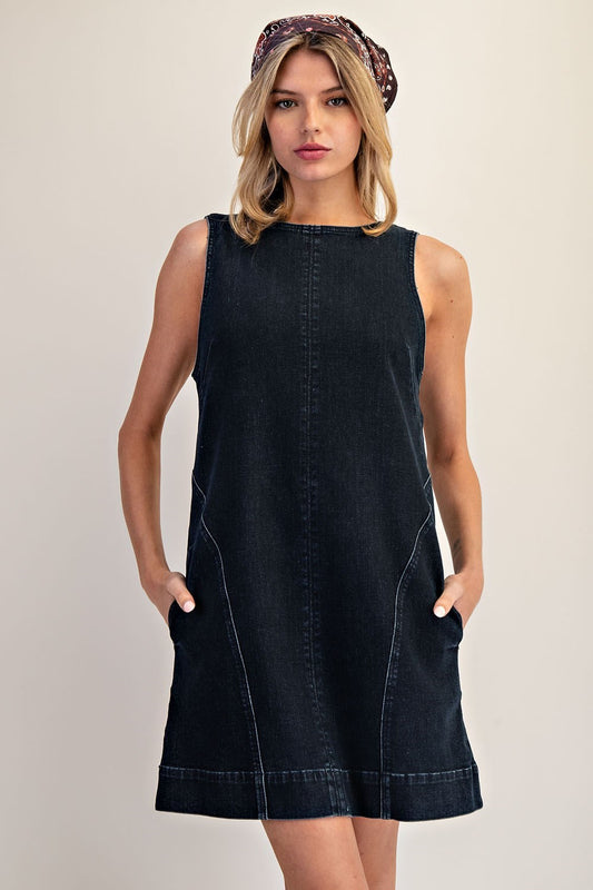 Soft-washed denim mini dress with an open back and modern shift silhouette.
