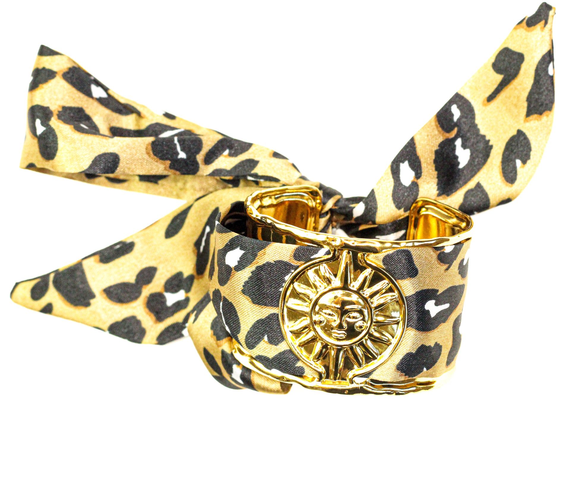 Bracelet with leopard print strap and gold clasp on a white background