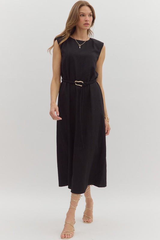 Solid muscle shoulder slit hem midi dress featuring embellished gold accent fastner belt. Single button keyhole closure at back neck. Lined. Woven. Non-sheer. Lightweight.