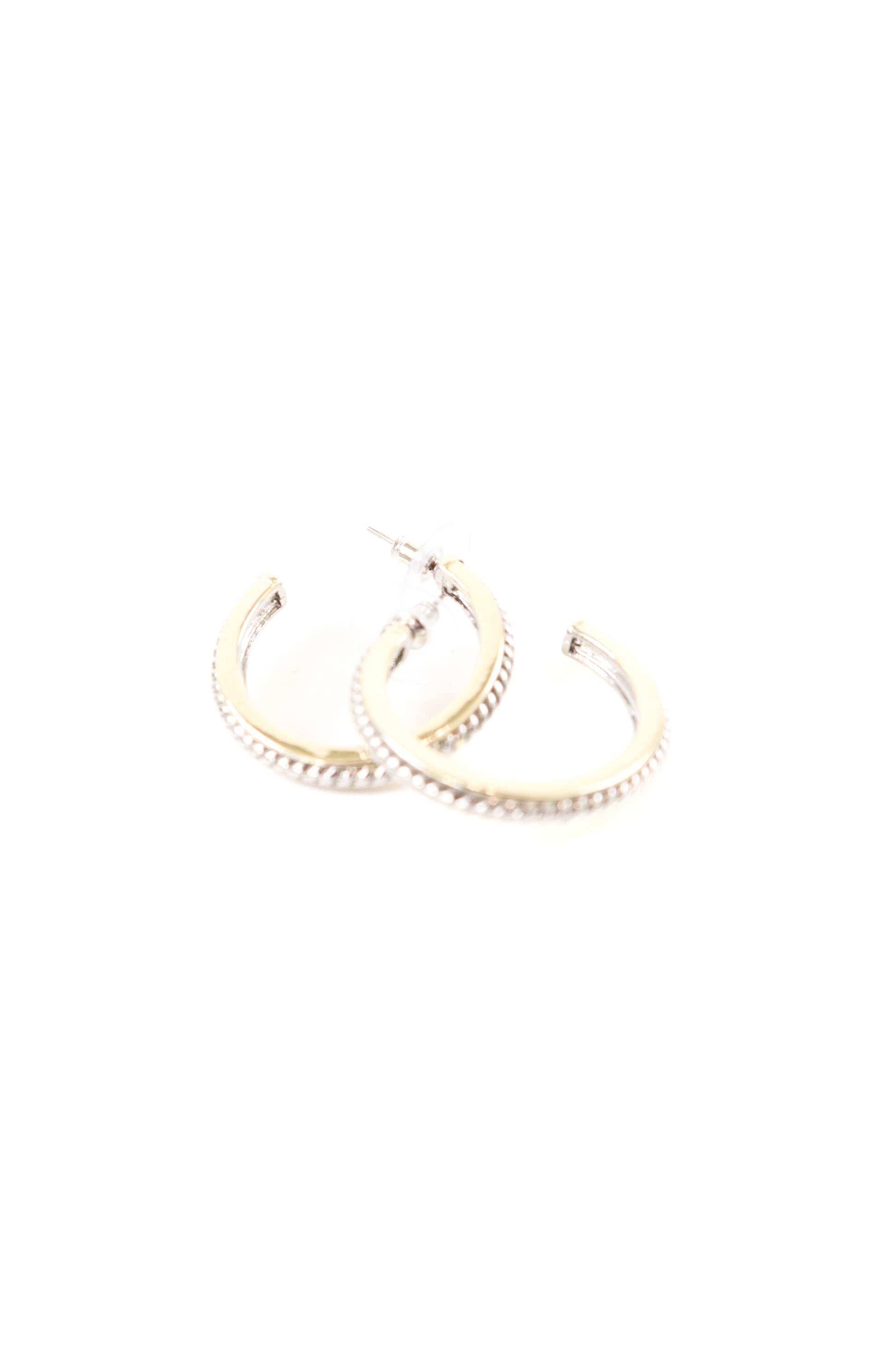 Gold hoop earrings with rope-textured edge detailing and stud post backing