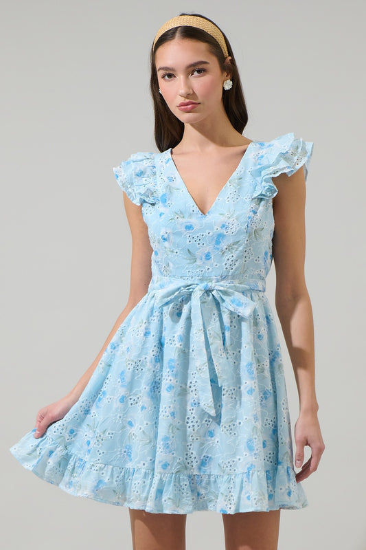 Light blue floral lace mini dress with ruffled sleeves, a V-neckline, and a waist tie, perfect for garden parties and feminine spring looks.