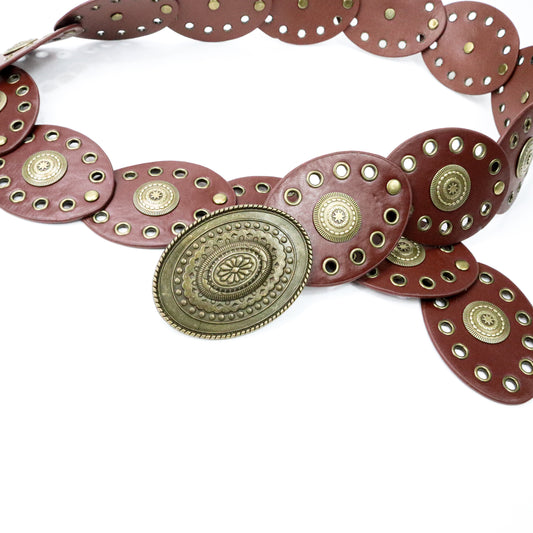 Brown leather belt with gold circular embellishments on a white background