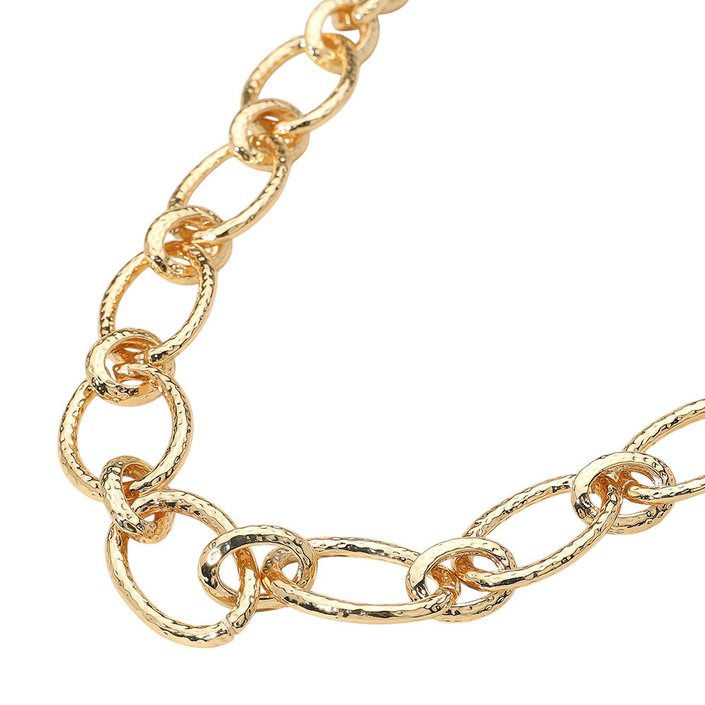 The Beatrix Necklace makes a striking impression with oversized textured oval links—bold, modern, and full of attitude.