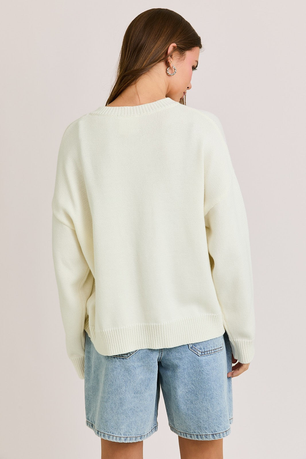 The Bernice Cardigan features a bold horse graphic design with a cozy knit blend, round neckline, and long sleeves for effortless statement layering.

