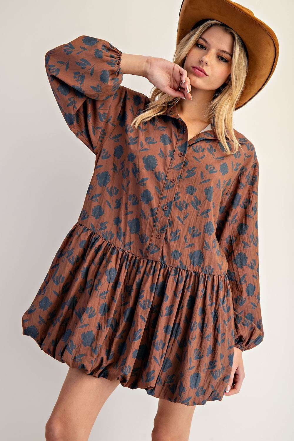 The Calista Printed Bubble Hem Dress blends playful volume with a lightweight floral design for a chic, standout look.

