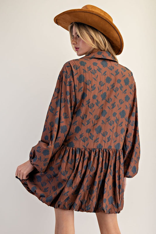 The Calista Printed Bubble Hem Dress blends playful volume with a lightweight floral design for a chic, standout look.

