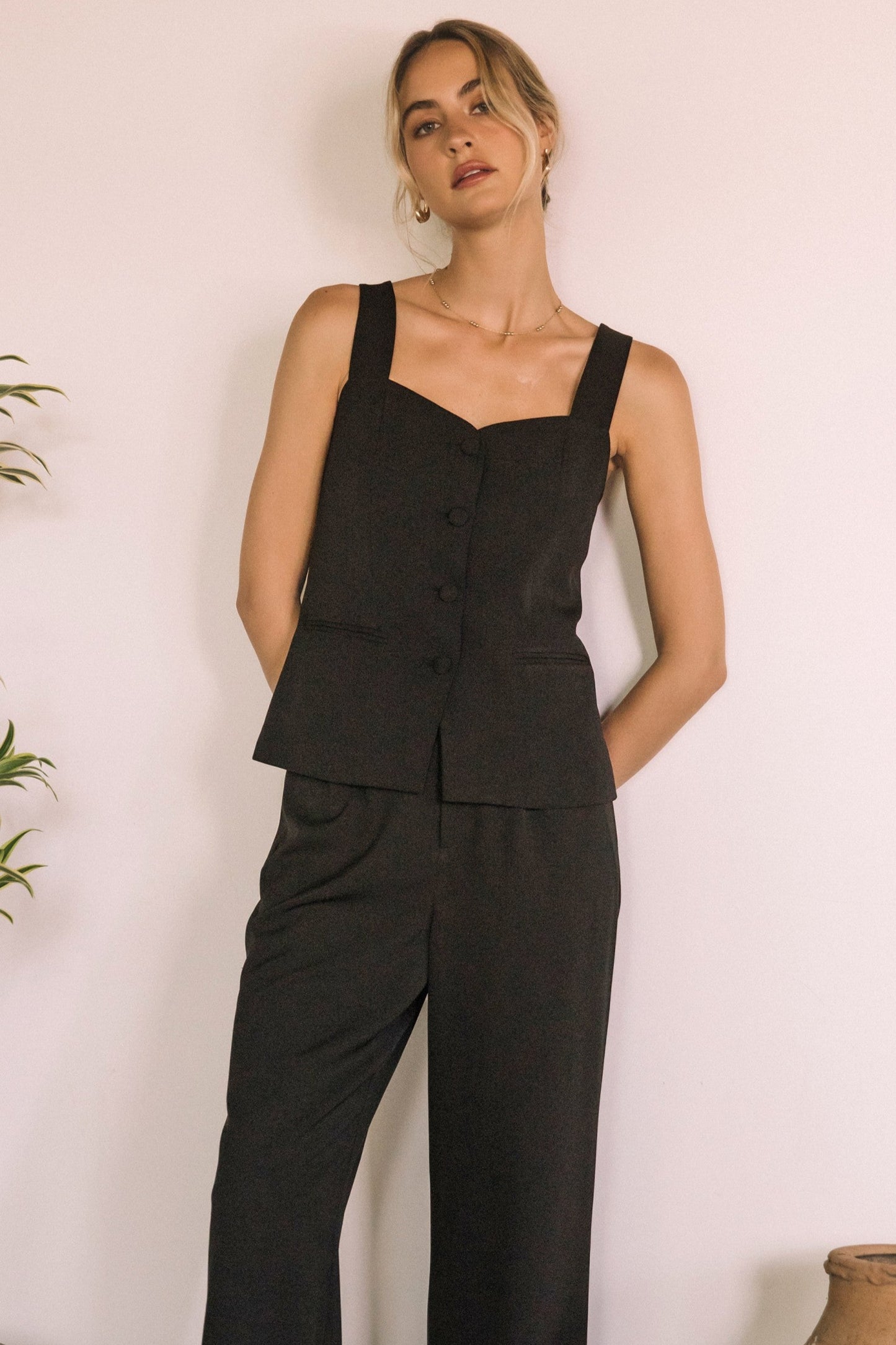 The Coralie Vest blends romantic shape with tailored edge, featuring a sweetheart neckline and button-down front for a flattering, feminine finish.

