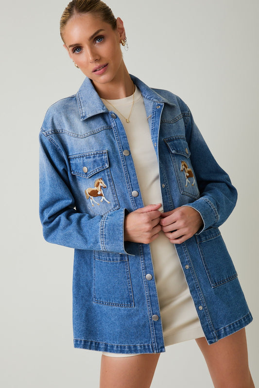 The Corrine Jacket blends vintage embroidery with modern denim tailoring—crafted in a soft cotton-rayon blend for a standout everyday staple.

