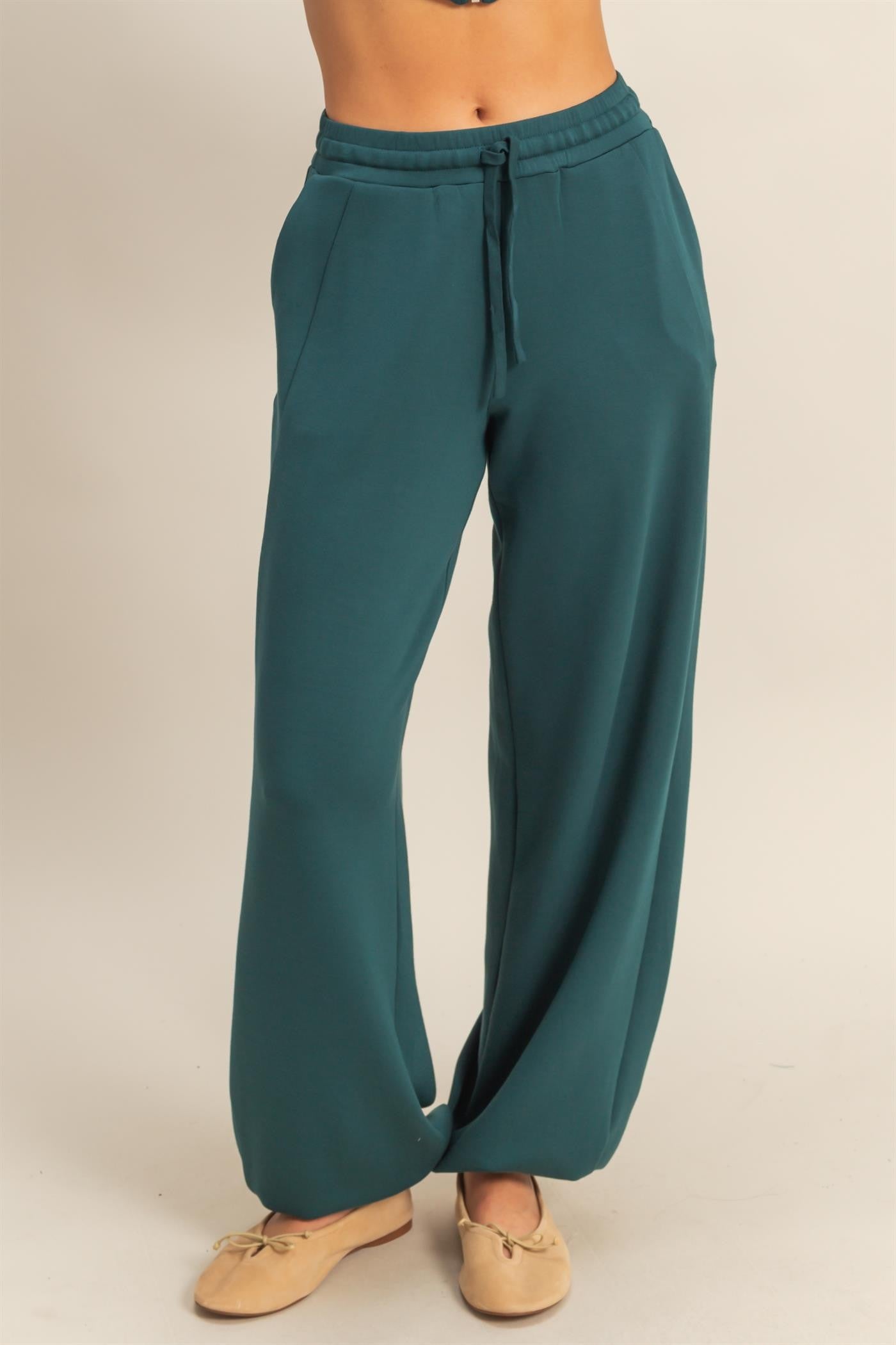 The Darcy Joggers feature ultra-soft scuba fabric, a drawstring waist, and ankle cuffs—your go-to for casual comfort with a clean, elevated fit.

