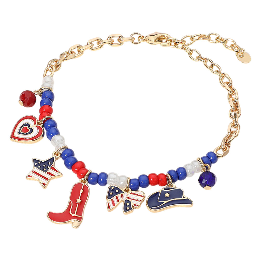 The Dixie Bracelet captures patriotic spirit with enamel USA flag charms—featuring a cowboy boot, hat, heart, and bow, all strung on a playful beaded station design.

