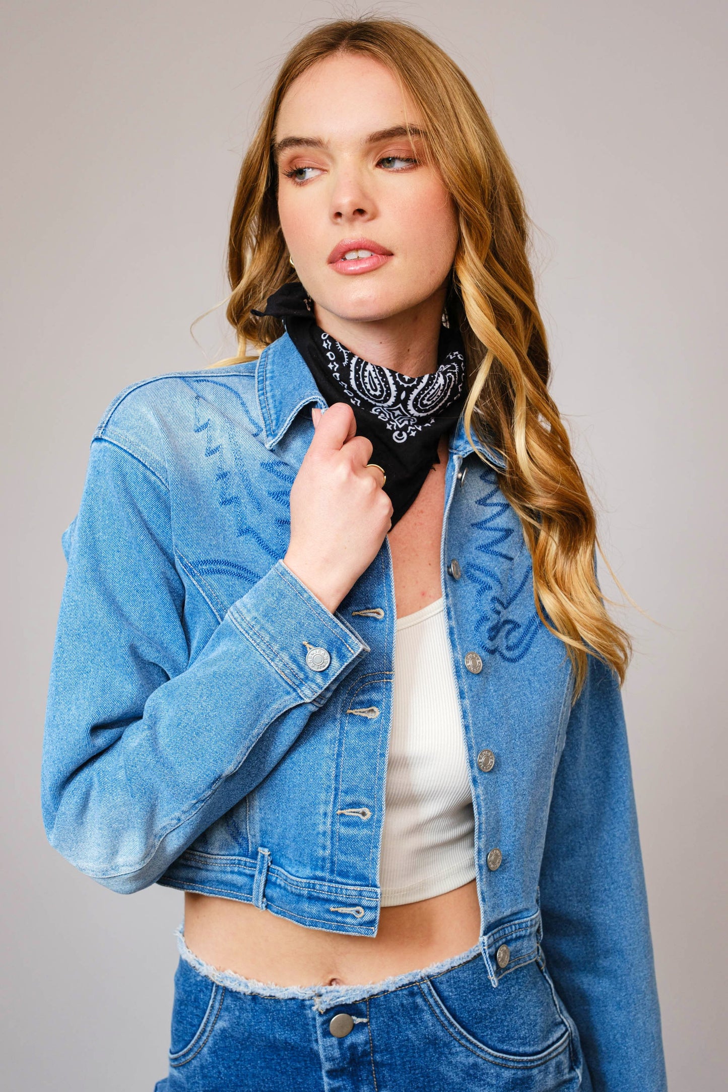 The Effie Jacket is a cropped denim essential with contrast patchwork, Western embroidery, and bold “Rodeo Queen” lettering on the back.