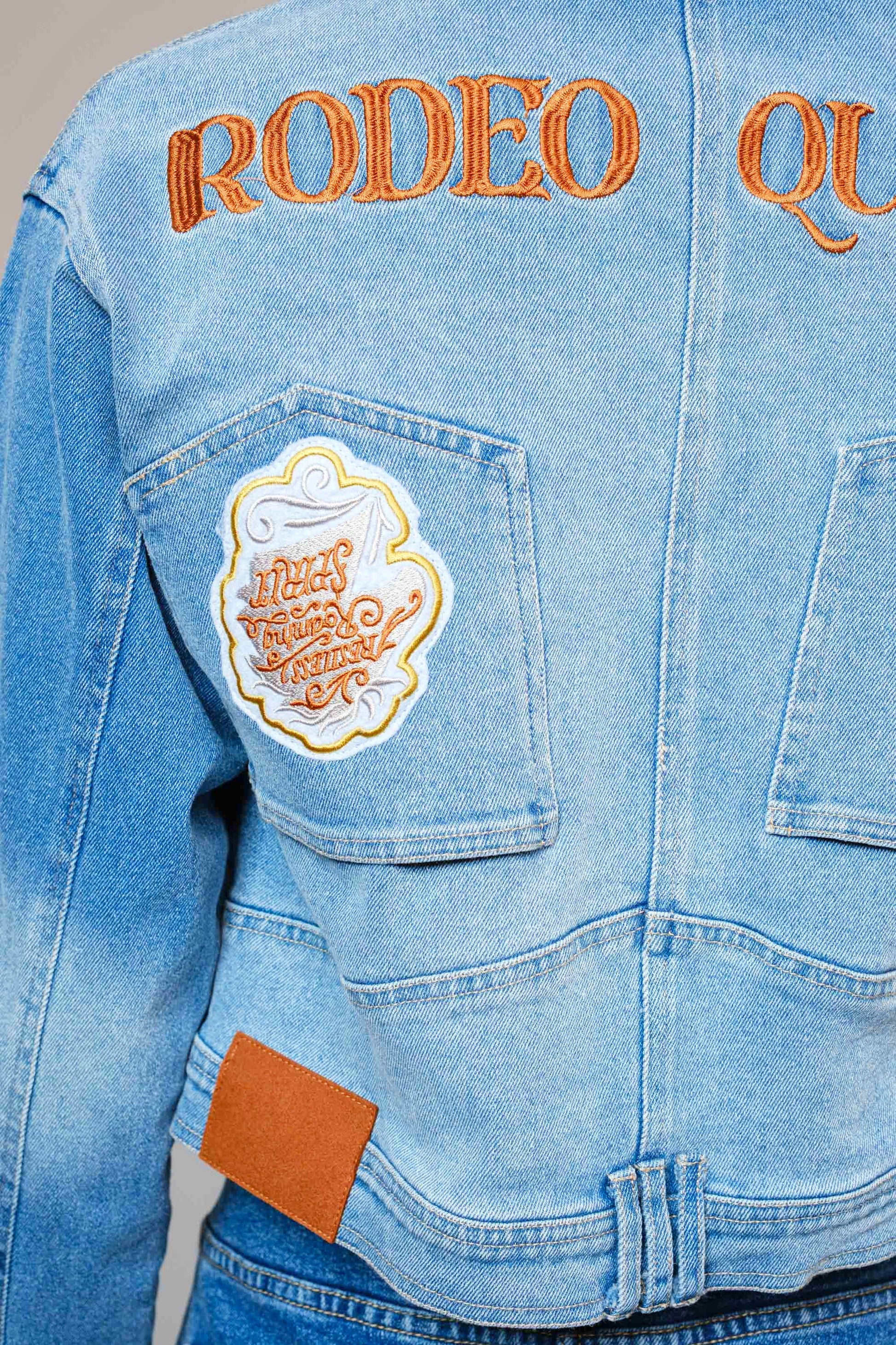 The Effie Jacket is a cropped denim essential with contrast patchwork, Western embroidery, and bold “Rodeo Queen” lettering on the back.