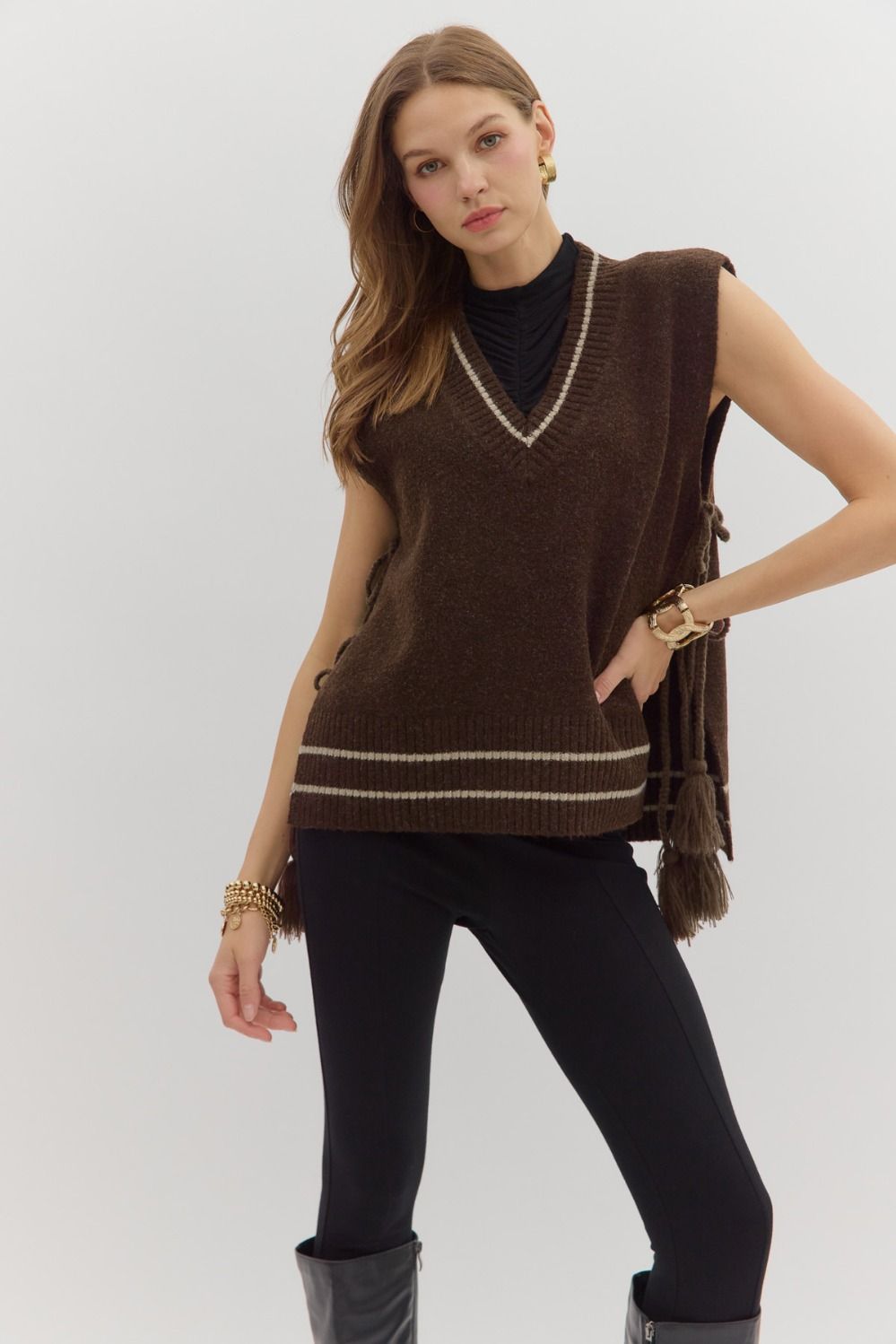 The Elora Vest is a varsity-inspired pullover crafted in soft sweater knit with a relaxed fit—perfect for layering or wearing solo.

