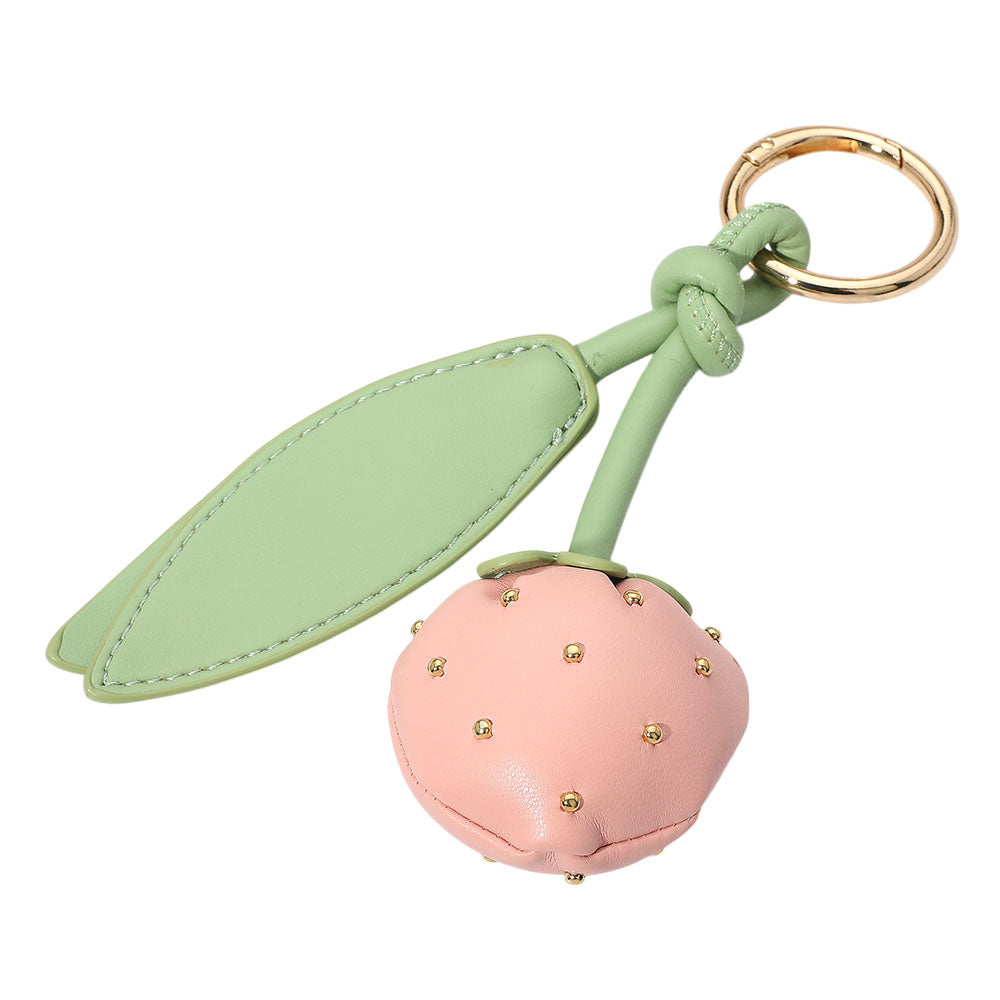 The Felicia Keychain adds a sweet touch to your accessories with its plush faux leather strawberry design—perfect as a bag charm or whimsical key holder.