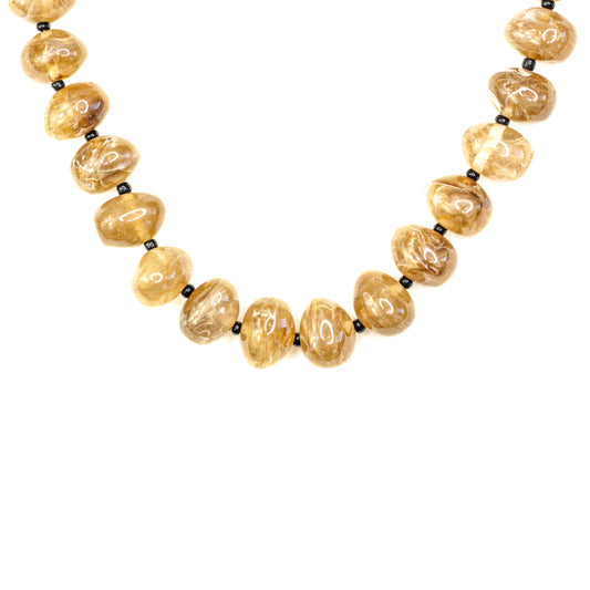 Necklace with large yellow beads on a white background