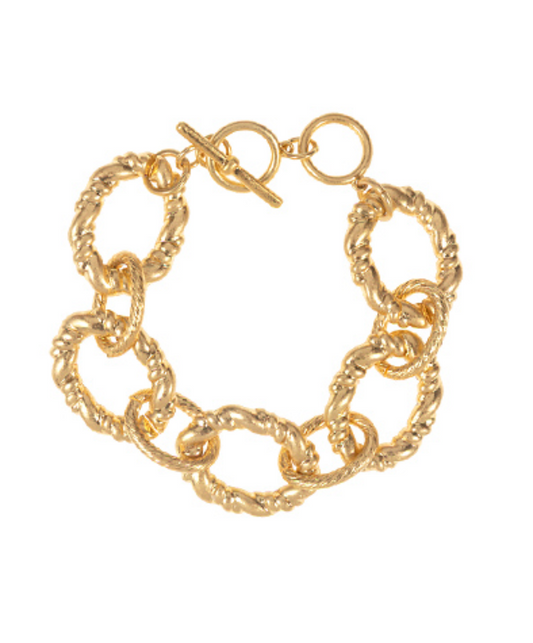 A vibrant gold-toned bracelet composed of large, textured oval links and secured with a stylish toggle clasp.